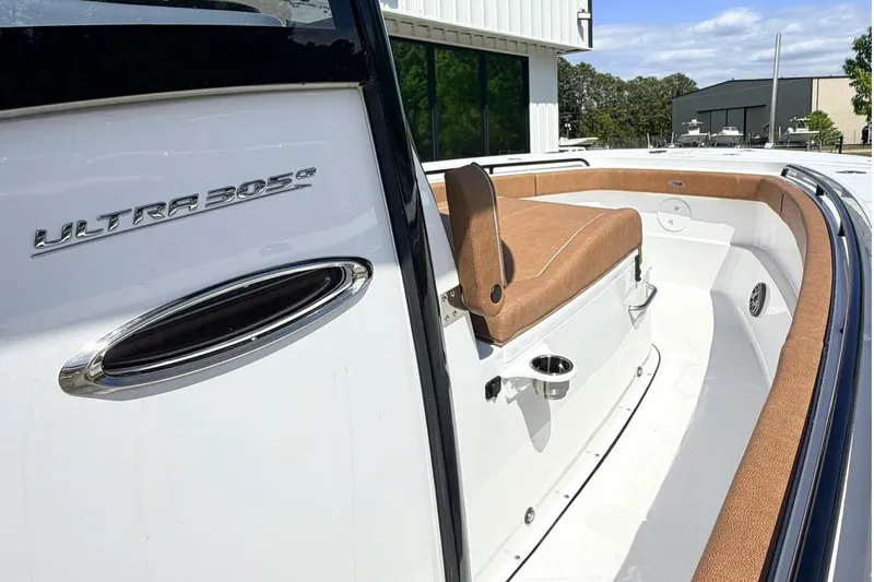 Slide: The Image of Sea Hunt Ultra 305 Coffin Box 2026 with brown upholstery. - 18