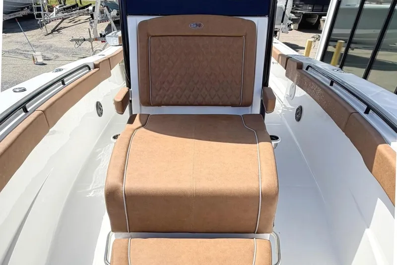 Slide: The Image of 2026 Sea Hunt Ultra 305 Coffin Box with brown upholstery. - 20