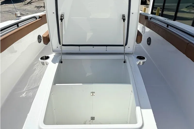 Slide: The Image of 2026 Sea Hunt Ultra 305 Coffin Box with open storage compartment. - 22