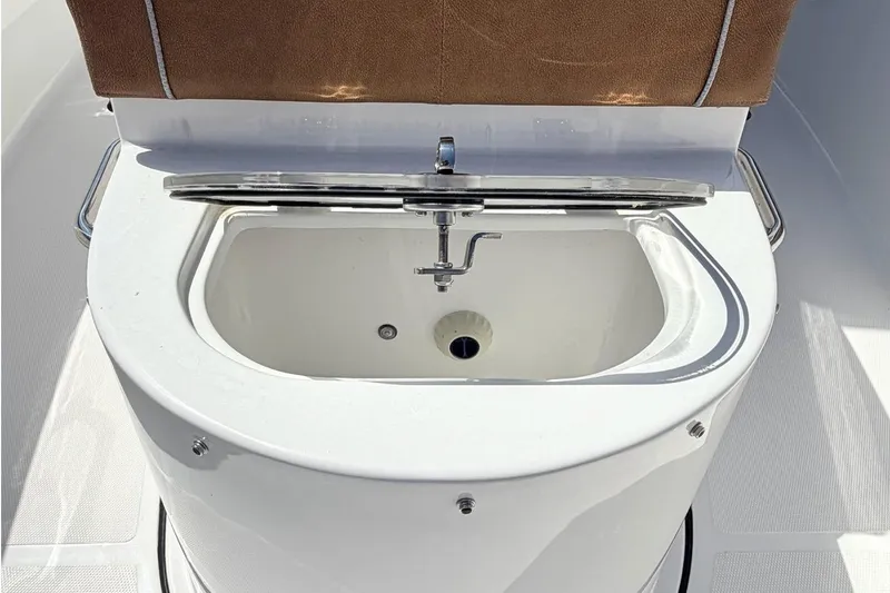 Slide: The Image of Sea Hunt Ultra 305 Coffin Box 2026 with open storage compartment. - 23