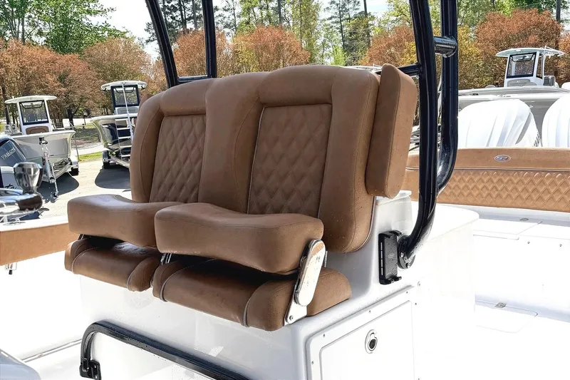 Slide: The Image of 2026 Seahunt Ultra 305 CB boat with luxurious brown seating and sleek design. - 8