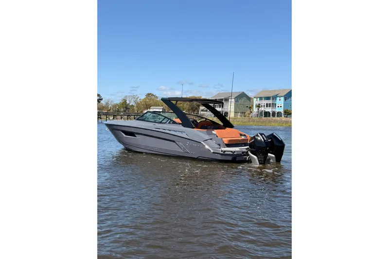 The Image of 2021 Cruisers Yachts 338 Bow Rider on water, modern design, sunny day. - 0
