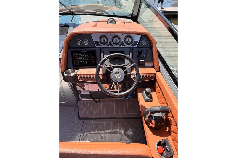 Slide: The Image of Cockpit of 2021 Cruisers Yachts 338 Bow Rider with modern controls and leather accents. - 11