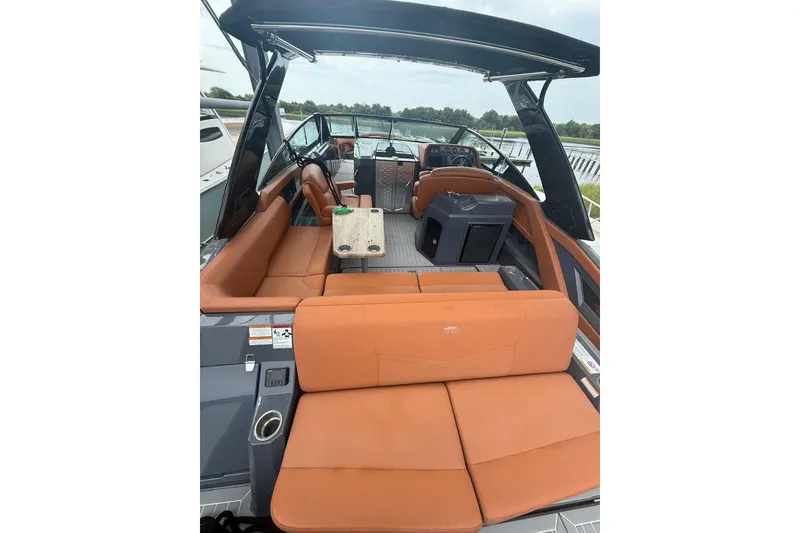 Slide: The Image of 2021 Cruisers Yachts 338 Bow Rider with luxurious tan seating and sleek design. - 14