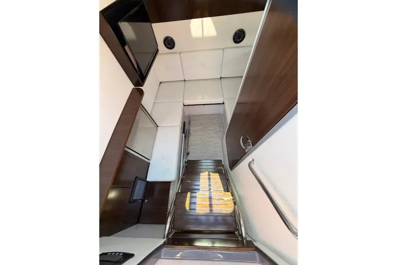Slide: The Image of Interior view of 2021 Cruisers Yachts 338 Bow Rider, featuring sleek seating and modern design. - 17