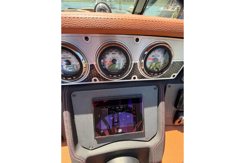 Slide: The Image of Dashboard of 2021 Cruisers Yachts 338 Bow Rider with gauges and digital display. - 21