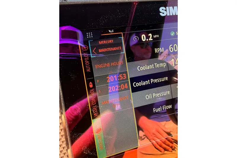 Slide: The Image of Display screen of 2021 Cruisers Yachts 338 Bow Rider showing engine metrics and maintenance data. - 22