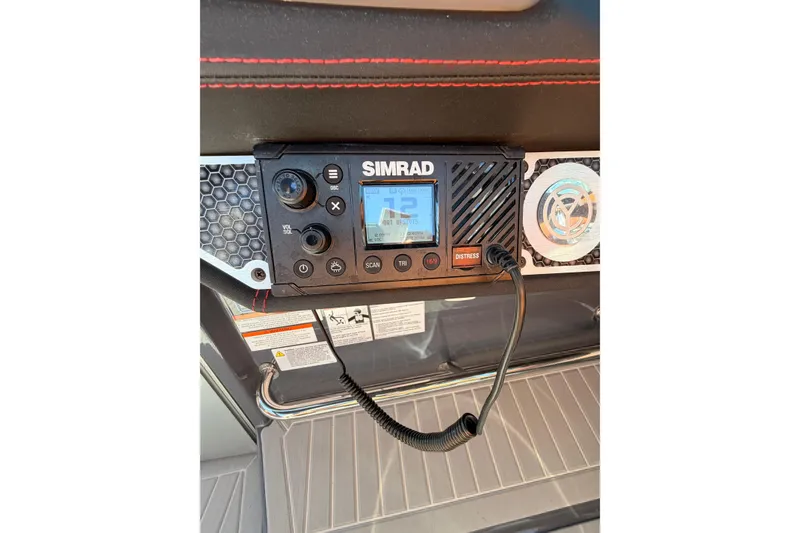 Slide: The Image of Simrad marine radio on 2021 Cruisers Yachts 338 Bow Rider dashboard. - 23