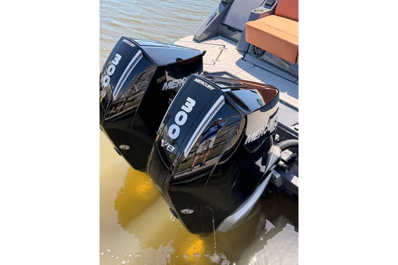 Slide: The Image of Twin Mercury 300 engines on a 2021 Cruisers Yachts 338 Bow Rider boat. - 28