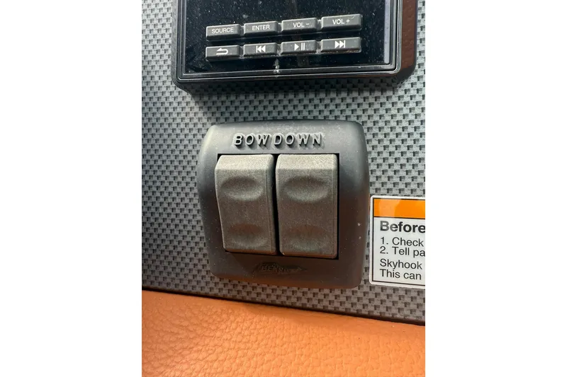 Slide: The Image of Control panel of 2021 Cruisers Yachts 338 Bow Rider with "Bow Down" switches. - 31