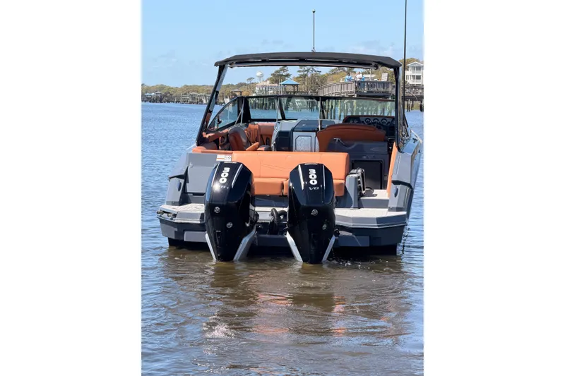 Slide: The Image of 2021 Cruisers Yachts 338 Bow Rider with dual 300 V8 engines on calm water. - 4