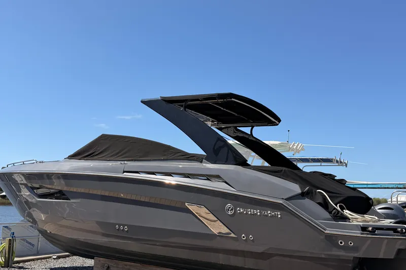 Slide: The Image of 2021 Cruisers Yachts 338 Bow Rider under clear blue sky. - 6