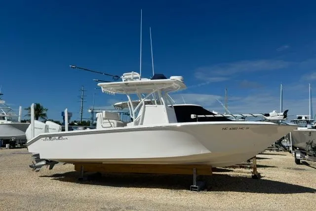 The Image of 2022 SeaHunter 28 Floridian boat on display under clear blue sky. - 0
