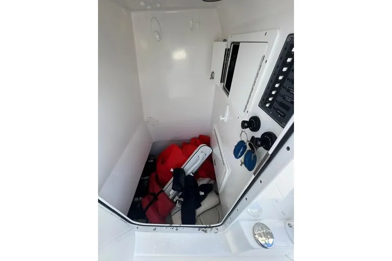 Slide: The Image of Interior cabin of 2022 SeaHunter 28 Floridian boat with storage and control panel. - 3