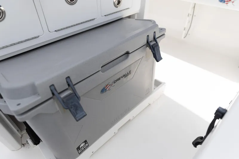 Slide: The Image of Crevalle 26 HCO 2023 model with integrated storage compartment and cooler. - 10