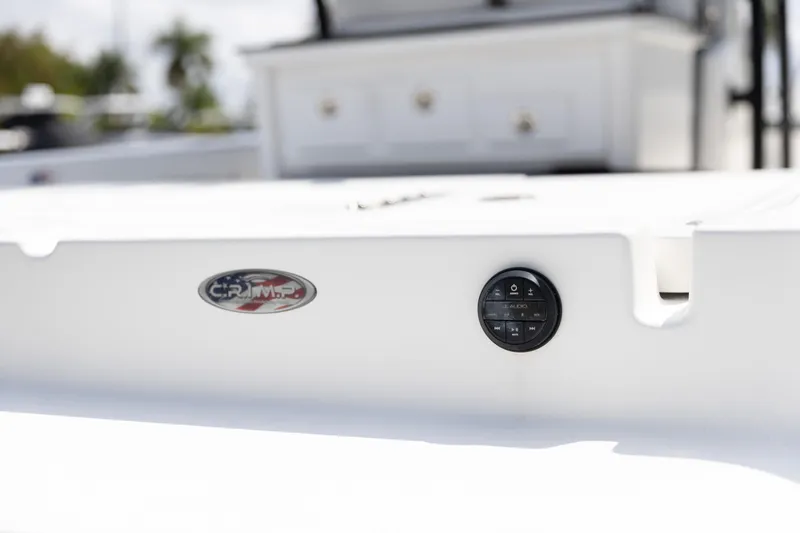 Slide: The Image of 2023 Crevalle 26 HCO boat deck with control panel and logo detail. - 15