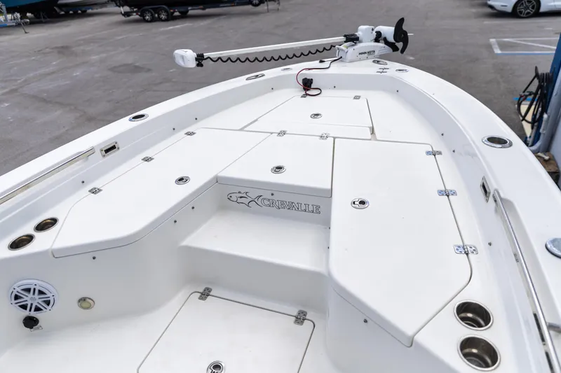 Slide: The Image of 2023 Crevalle 26 HCO boat deck with storage compartments and fishing rod holders. - 3