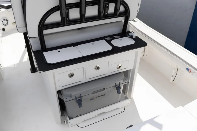 Slide: The Image of 2023 Crevalle 26 HCO boat interior with storage drawers and cooler. - 7