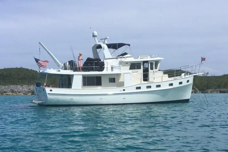 Slide: The Image of 2011 Kadey-Krogen 48 AE yacht anchored in clear blue water. - 13