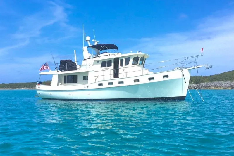 Slide: The Image of 2011 Kadey-Krogen 48 AE yacht anchored in clear blue waters. - 16