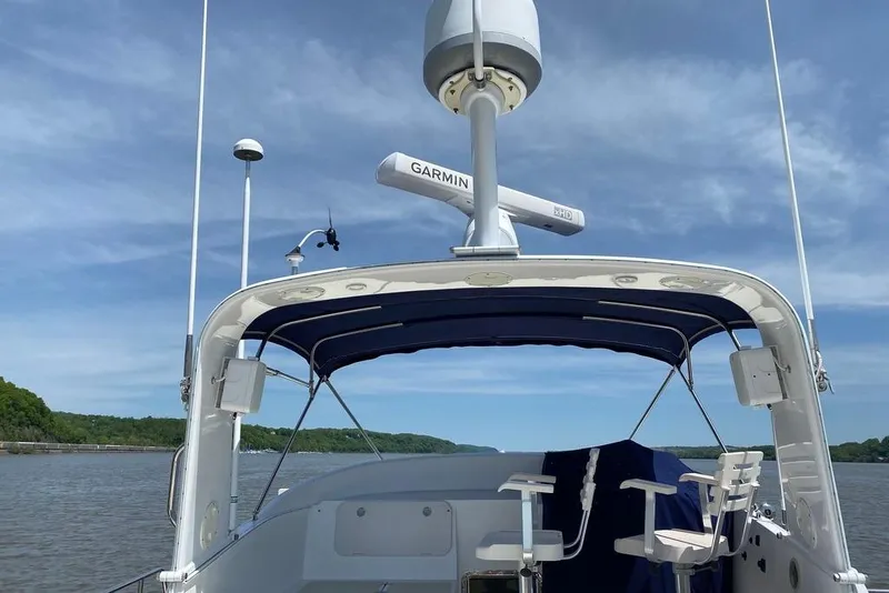 Slide: The Image of Kadey-Krogen 48 AE 2011 yacht with Garmin radar, cruising on a calm river. - 19