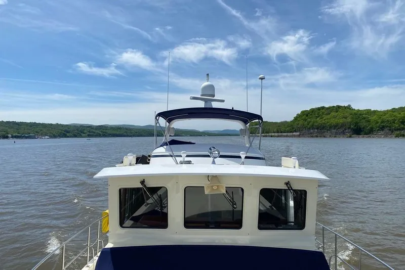 Slide: The Image of Kadey-Krogen 48 AE yacht cruising on a scenic river, 2011 model. - 24