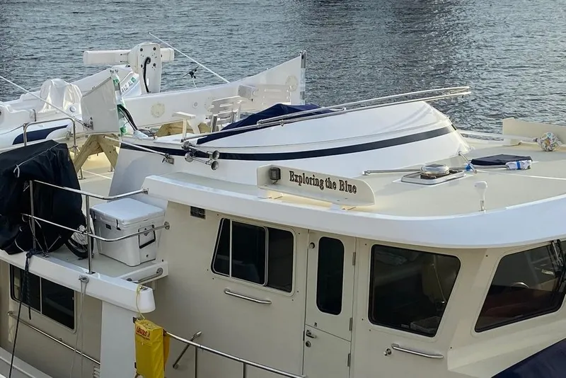 Slide: The Image of Kadey-Krogen 48 AE 2011 yacht named "Exploring the Blue" docked by the water. - 29