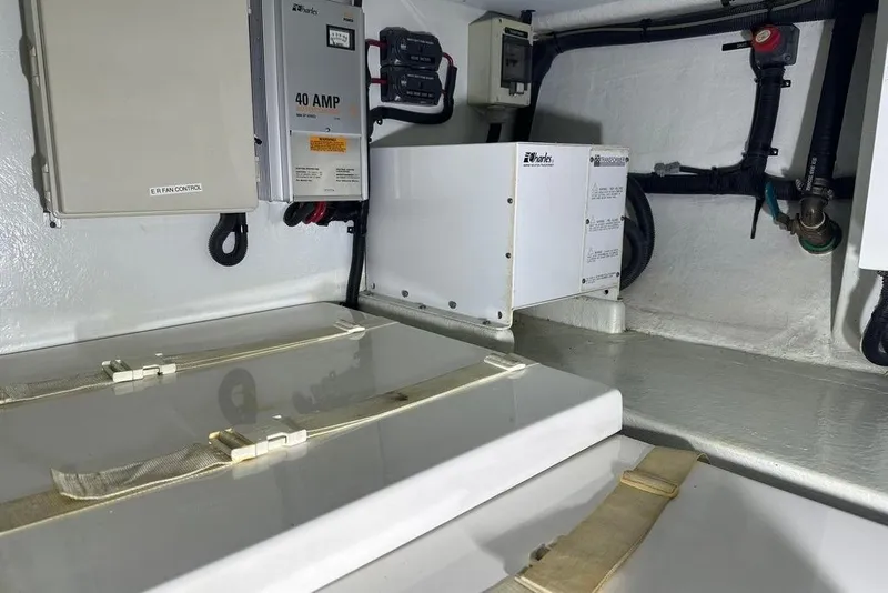 Slide: The Image of Engine room of 2011 Kadey-Krogen 48 AE with electrical components and wiring. - 33