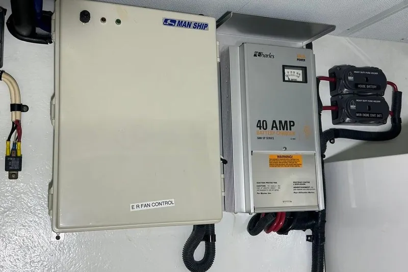 Slide: The Image of Electrical panel and battery charger in a 2011 Kadey-Krogen 48 AE yacht. - 35