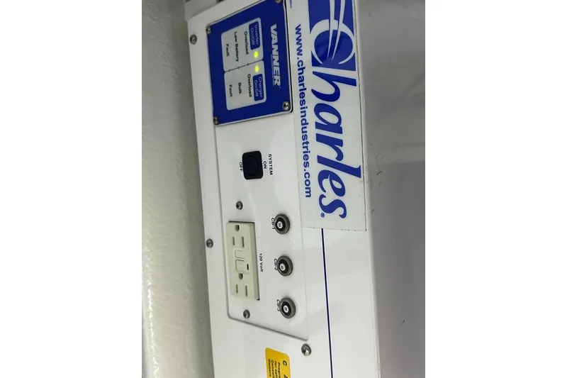 Slide: The Image of Electrical panel on a 2011 Kadey-Krogen 48 AE boat, featuring Charles Industries components. - 36