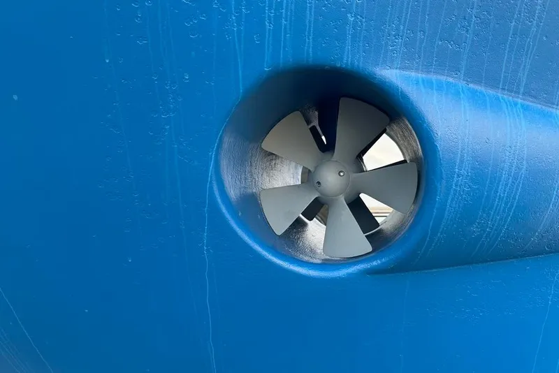 Slide: The Image of Close-up of a 2011 Kadey-Krogen 48 AE boat's blue hull with a bow thruster. - 39