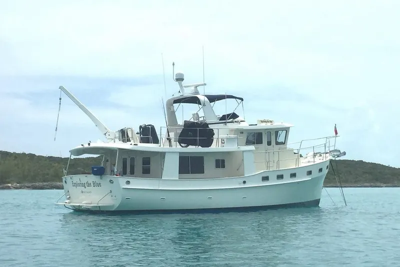 Slide: The Image of 2011 Kadey-Krogen 48 AE yacht anchored in serene turquoise waters. - 5