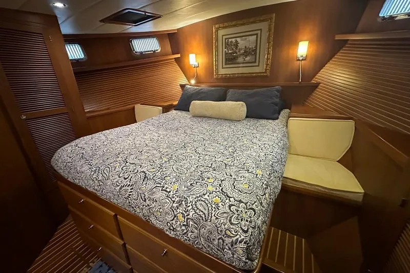 Slide: The Image of Luxurious cabin interior of 2011 Kadey-Krogen 48 AE yacht with cozy bedding. - 50
