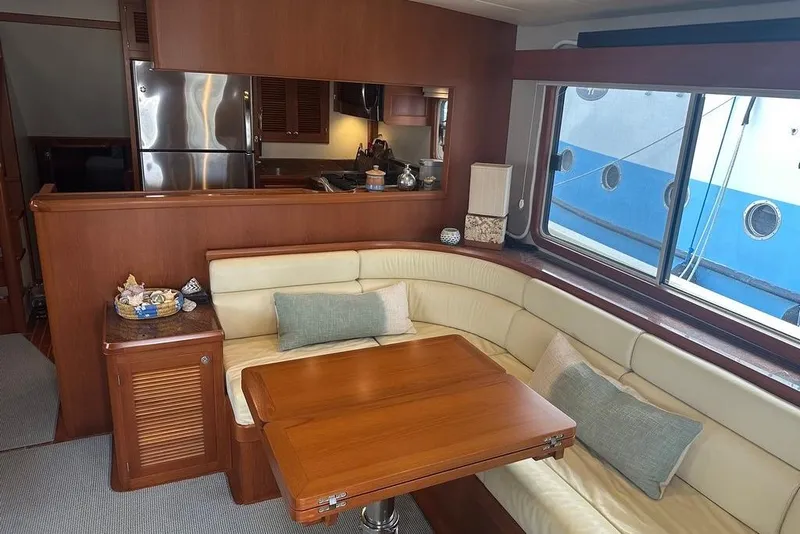 Slide: The Image of Luxurious interior of 2011 Kadey-Krogen 48 AE yacht with cozy seating and dining area. - 55