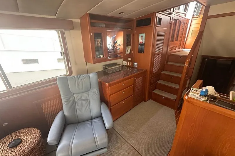 Slide: The Image of Interior of 2011 Kadey-Krogen 48 AE yacht with comfortable seating and wooden cabinetry. - 59