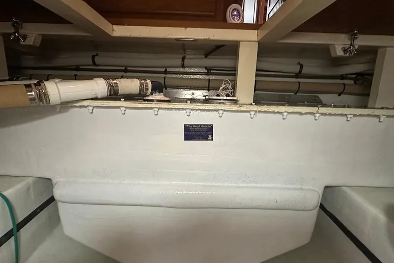 Slide: The Image of Interior view of 2011 Kadey-Krogen 48 AE boat showing pipes and storage area. - 65