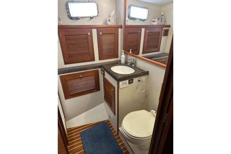 Slide: The Image of Bathroom interior of 2011 Kadey-Krogen 48 AE yacht with wooden cabinets and modern fixtures. - 66