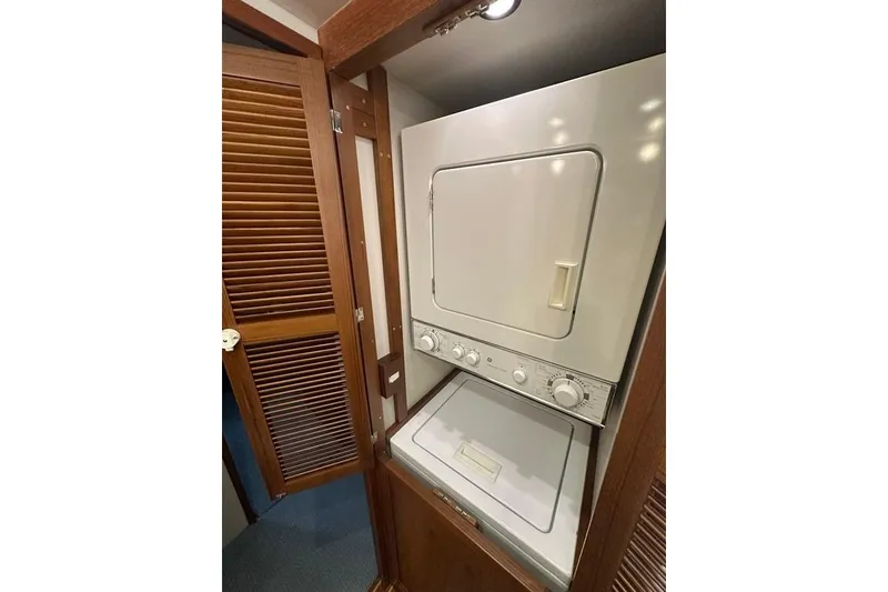 Slide: The Image of Stacked washer and dryer in 2011 Kadey-Krogen 48 AE yacht interior. - 68