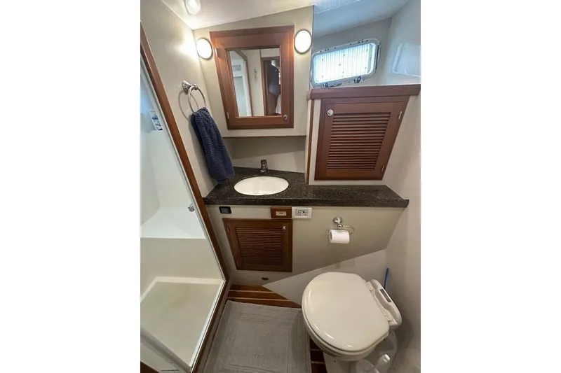 Slide: The Image of Kadey-Krogen 48 AE 2011 yacht bathroom with sink, toilet, and shower. - 69