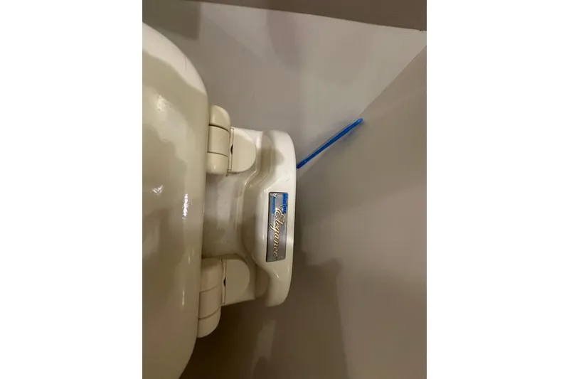 Slide: The Image of Toilet seat on 2011 Kadey-Krogen 48 AE yacht, featuring "Elegance" branding. - 71