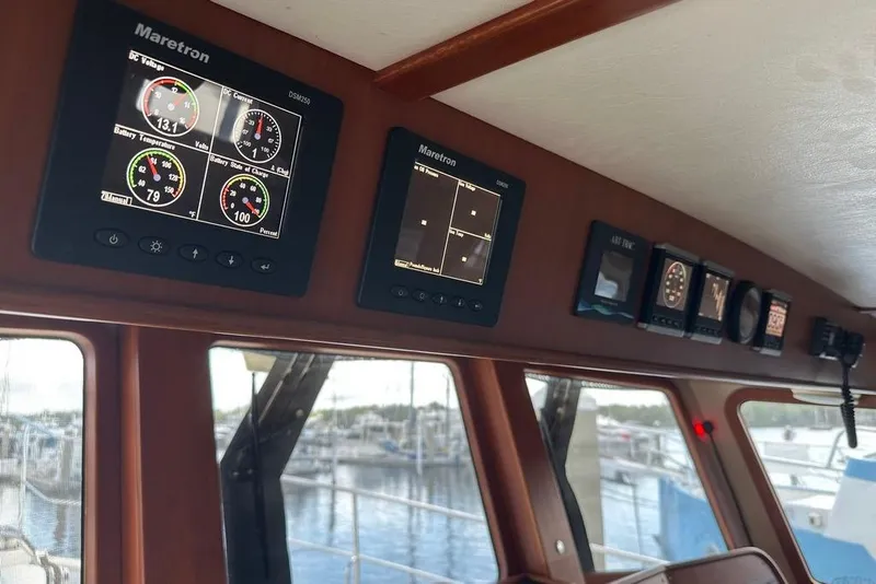 Slide: The Image of Control panel of a 2011 Kadey-Krogen 48 AE yacht with Maretron displays. - 76