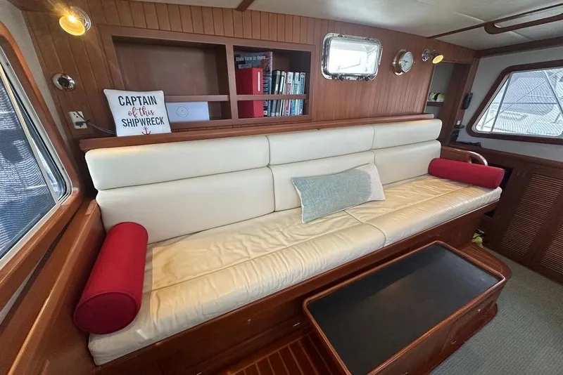 Slide: The Image of Luxurious interior of 2011 Kadey-Krogen 48 AE yacht with comfortable seating and nautical decor. - 78