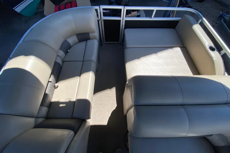 Slide: The Image of 2021 Sun Tracker Party Barge 22 DLX interior with spacious seating and modern design. - 9
