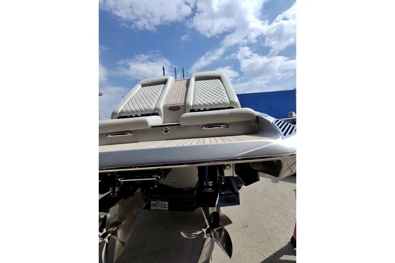 Slide: The Image of Sleek Monte Carlo 420 boat rear view, 2017 model, with luxurious seating and propellers. - 10