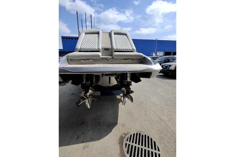 Slide: The Image of Rear view of 2017 Monte Carlo 420 boat with dual propellers in a parking area. - 14