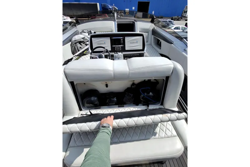 Slide: The Image of Interior view of a 2017 Monte Carlo 420 yacht cockpit with Garmin navigation system. - 21