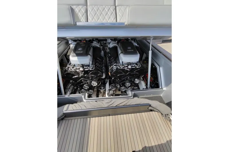 Slide: The Image of Twin engines in a 2017 Monte Carlo 420 yacht, showcasing powerful marine engineering. - 23