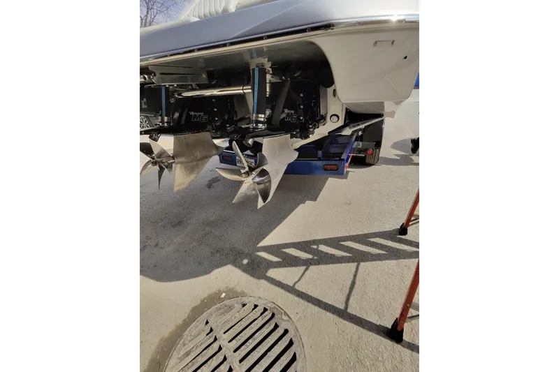 Slide: The Image of Rear view of 2017 Monte Carlo 420 boat with dual propellers on a trailer. - 29