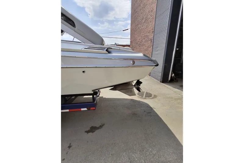 Slide: The Image of 2017 Monte Carlo 420 boat on trailer near industrial building. - 30