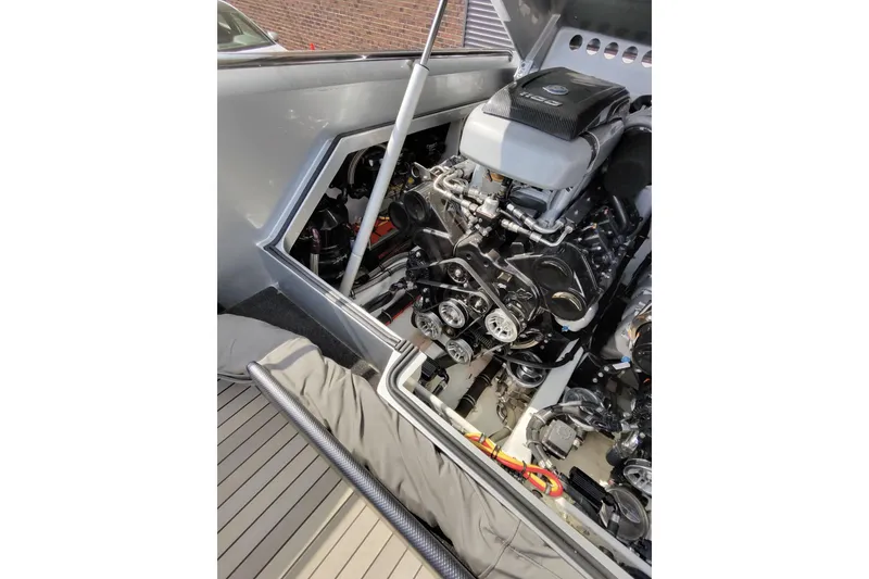 Slide: The Image of Engine compartment of a 2017 Monte Carlo 420 boat, showcasing detailed mechanical components. - 32